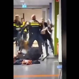 Zwangere vrouw die in azc naar grond werd gewerkt door agenten doet aangifte